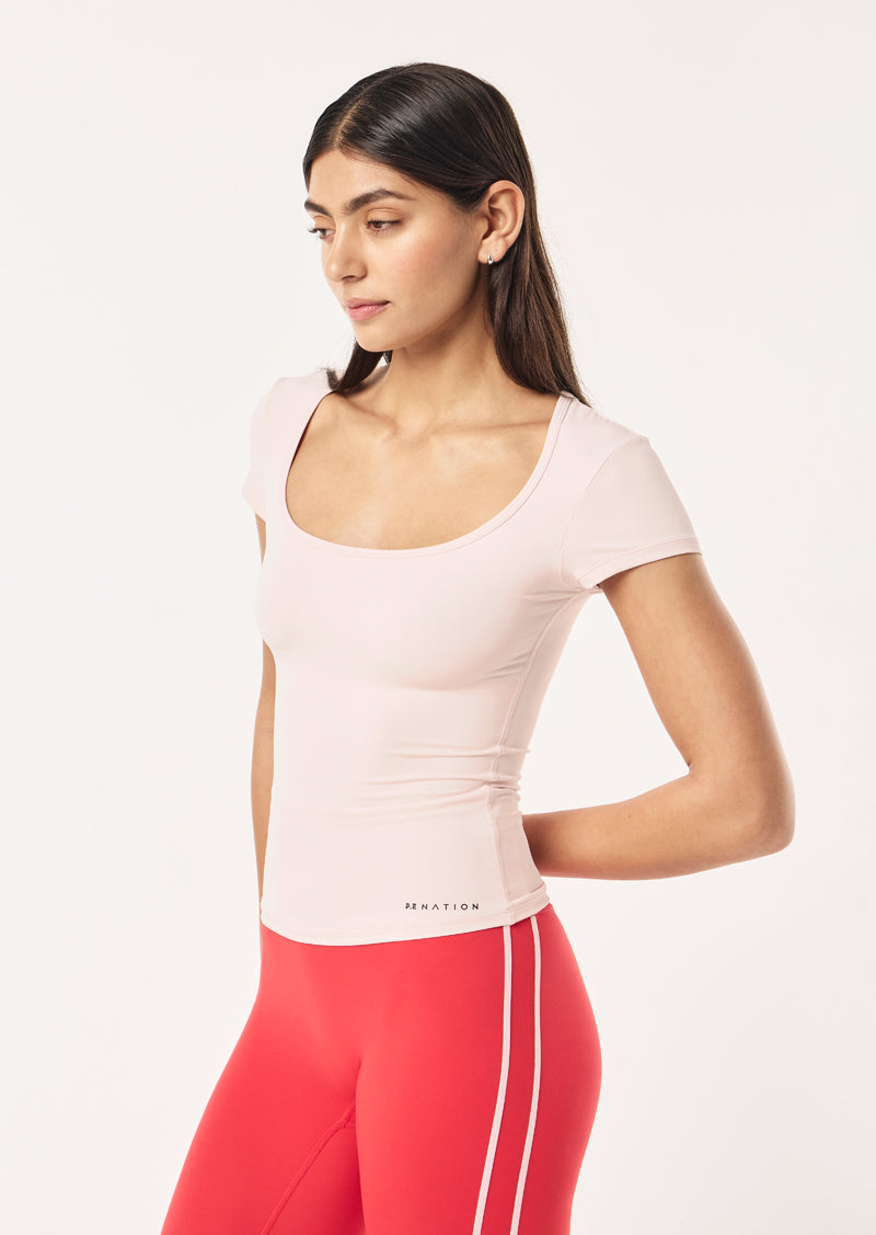 FOUNDATION SCOOP SHORT SLEEVE TOP IN SOFT PINK BY P.E NATION, WOMEN'S ATHLEISURE SHORT SLEEVE TEES