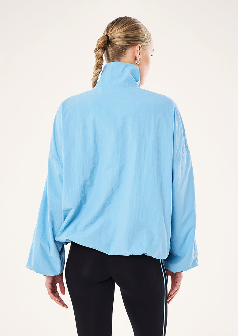 RADIUS JACKET IN ALASKAN BLUE BY P.E NATION, WOMEN'S ATHLEISURE SPRAY JACKETS