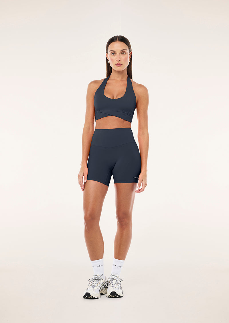 RESET HALTER SPORTS BRA IN MARINE BLUE BY P.E NATION, WOMEN'S ATHLEISURE SPORTS BRA