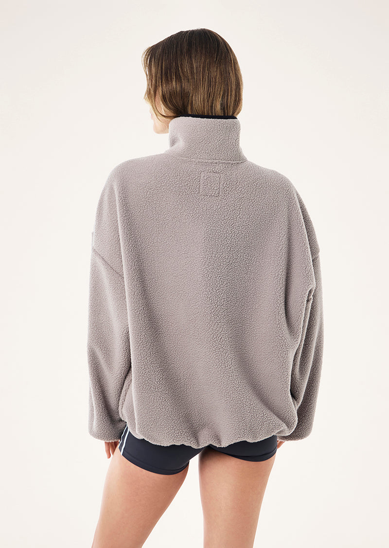 ROTATE QUARTER ZIP IN GREY