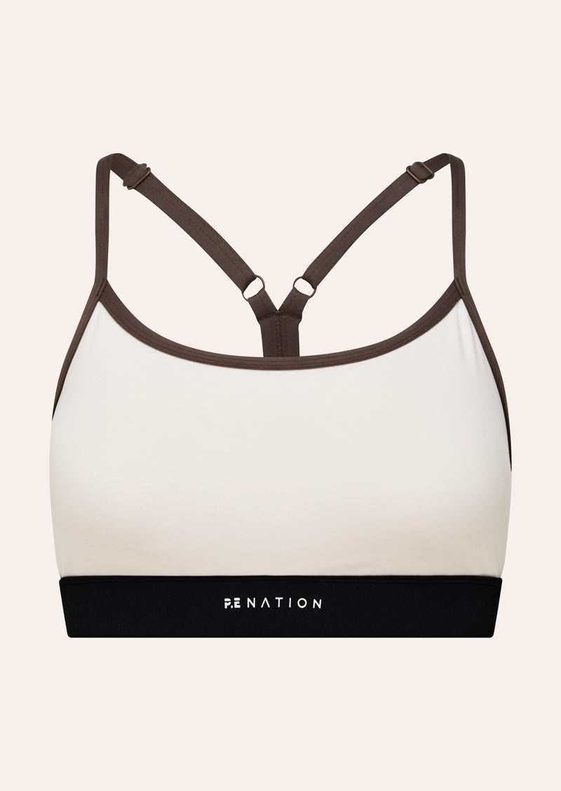 SIGNATURE SPORTS BRA IN WHISPER WHITE BY P.E NATION WOMENS SPORTS BRA CREAM