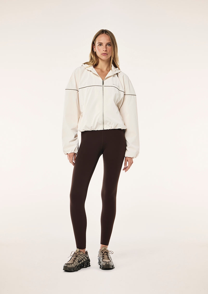 VERTEX JACKET IN WHISPER WHITE BY P.E NATION, WOMENS ATHLEISURE TRACK JACKET OUTERWEAR, CREAM
