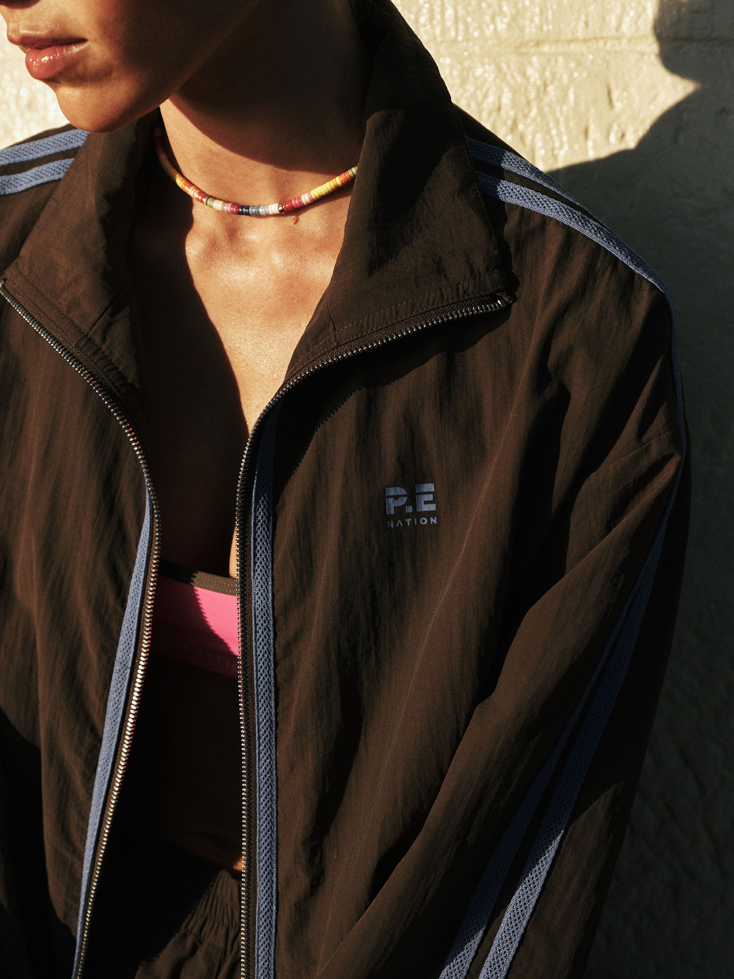 RELAY SPRAY JACKET IN COFFEE BY P.E NATION WOMENS ATHLEISURE WIND JACKET