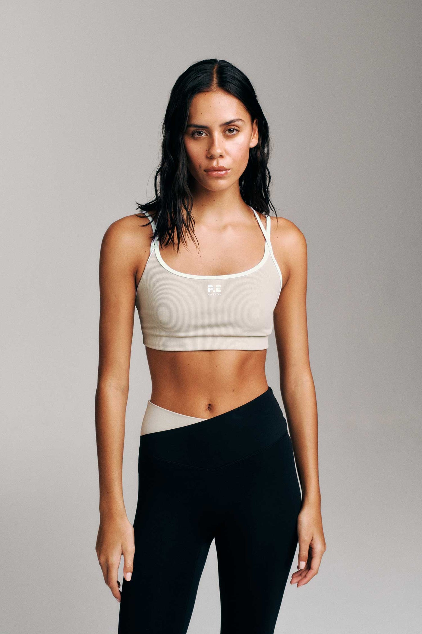 TERRACE SPORTS BRA IN BISCUIT BY P.E NATION WOMENS ATHLEISURE SPORTS BRA 