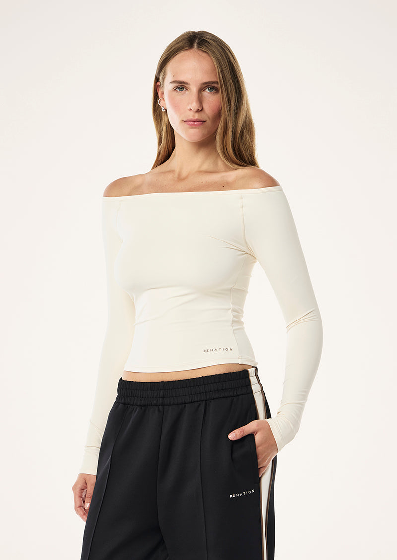 AURA LONG SLEEVE TOP IN WHISPER WHITE BY P.E NATION, WOMENS ATHLEISURE ACTIVE TOP CREAM