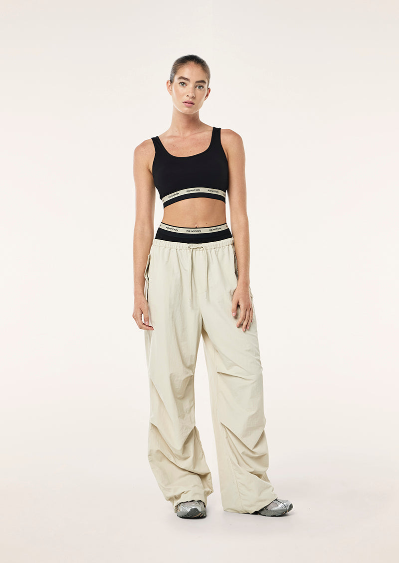 AVANT SCOOP SPORTS BRA IN BLACK AND BISCUIT BY P.E NATION WOMENS ATHLEISURE SPORTS BRA