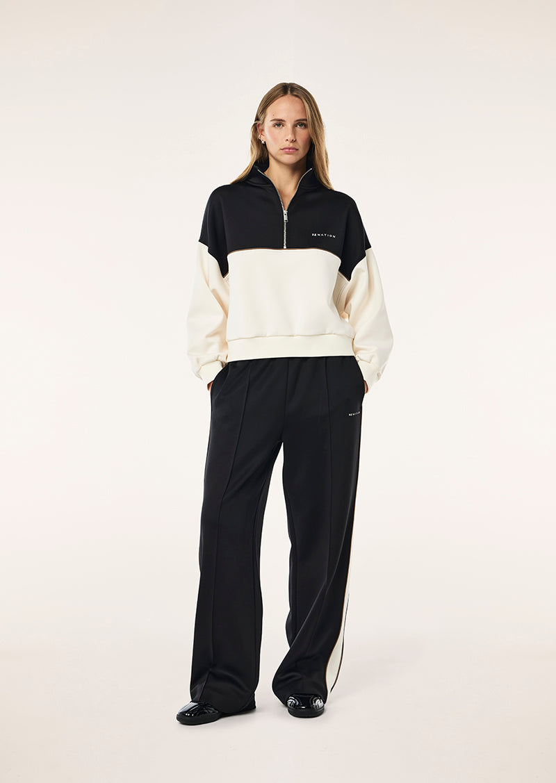 BOUNDLESS ZIP NECK SWEAT IN WHISPER WHITE BY P.E NATION, WOMENS ATHLEISURE QUARTER ZIP SWEAT TOP CREAM