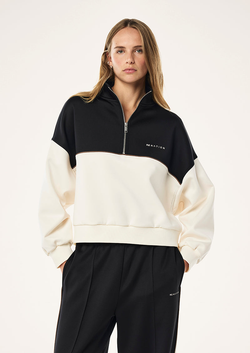 BOUNDLESS ZIP NECK SWEAT IN WHISPER WHITE BY P.E NATION 