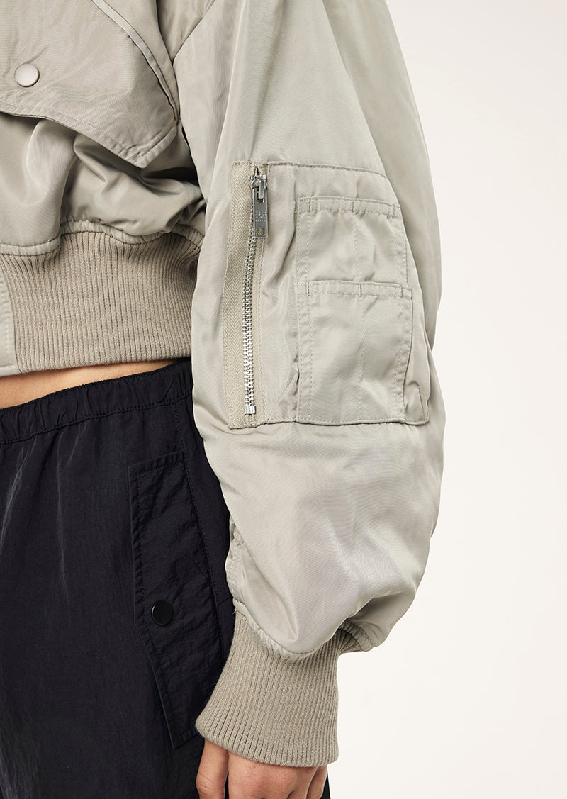 CAPTIVATE BOMBER IN BISCUIT BY P.E NATION WOMENS ATHLEISURE JACKET 
