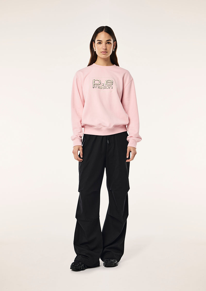 FLUX SWEAT IN CHALK PINK BY P.E NATION, WOMENS ATHLEISURE GRAPHIC SWEATSHIRT PINK