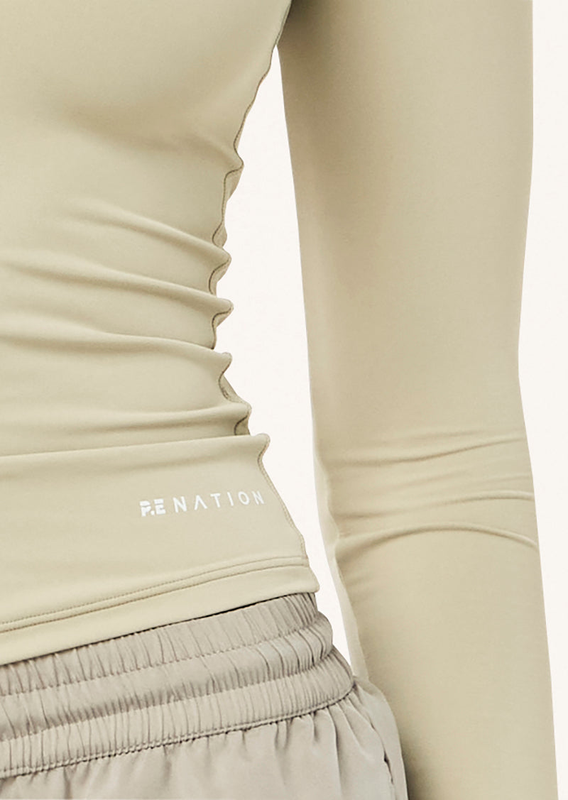 FOUNDATION LONG SLEEVE TOP IN BISCUIT BY P.E NATION WOMENS ATHLEISURE LONG SLEEVE TOP