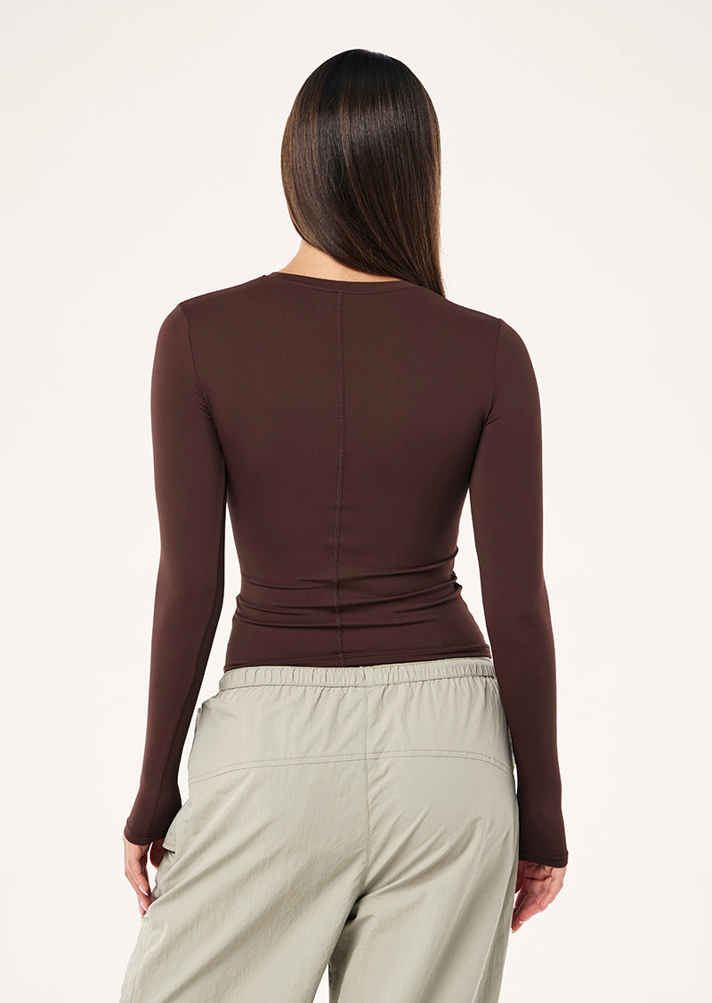 FOUNDATION LONG SLEEVE TOP IN MAHOGANY BY P.E NATION WOMENS ATHLEISURE TOP