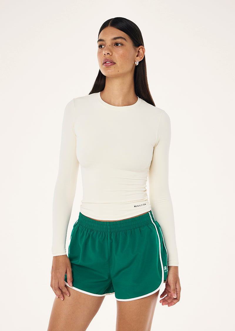 FOUNDATION LONG SLEEVE TOP IN WHISPER WHITE BY P.E NATION