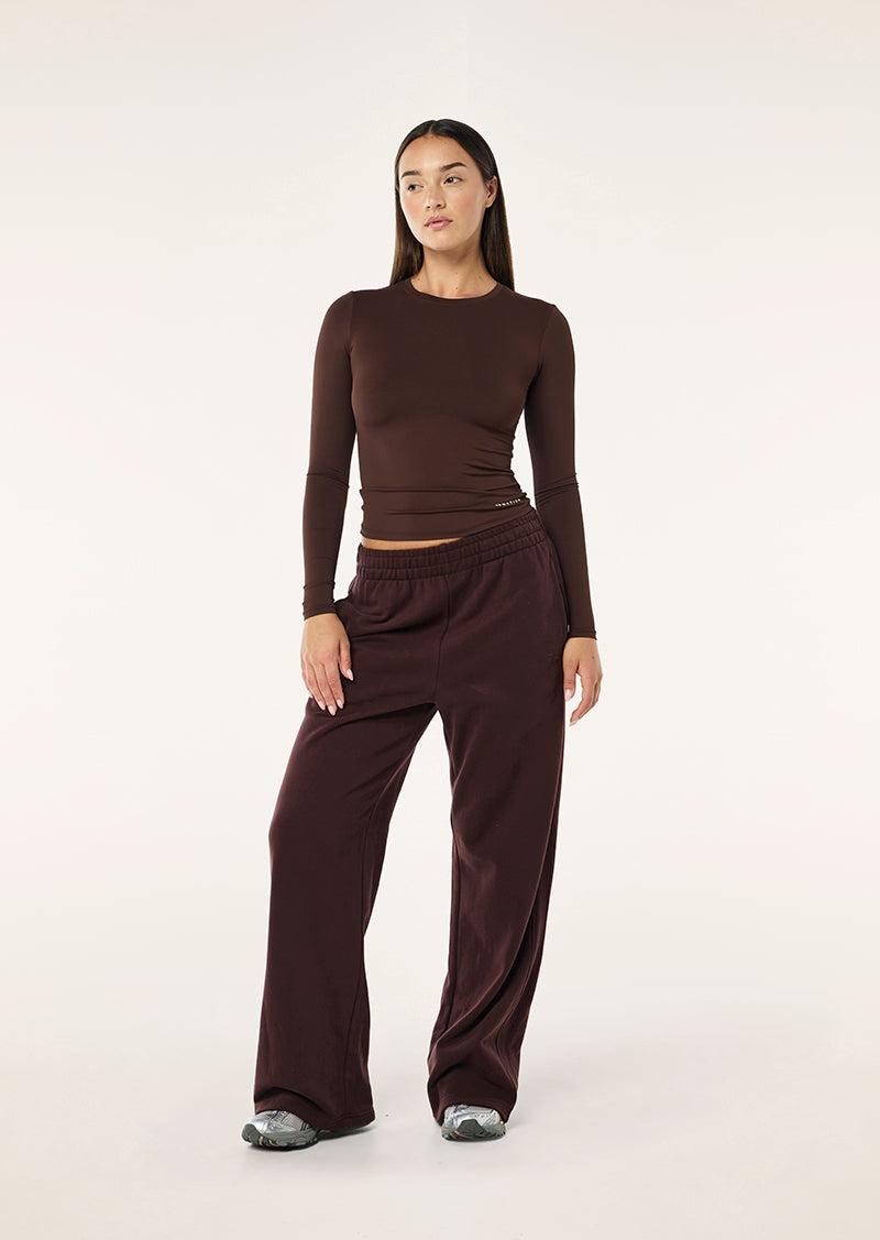 FOUNDATION LONG SLEEVE TOP IN MAHOGANY BY P.E NATION WOMENS ATHLEISURE TOP