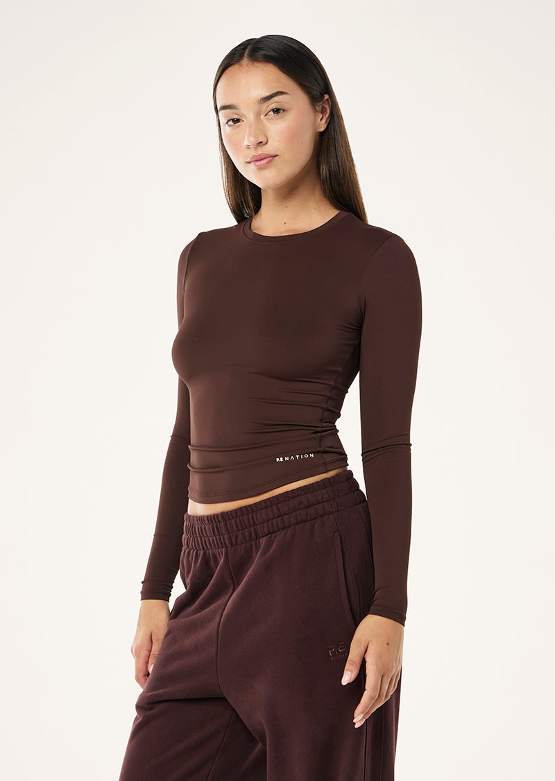 FOUNDATION LONG SLEEVE TOP IN MAHOGANY BY P.E NATION WOMENS ATHLEISURE TOP