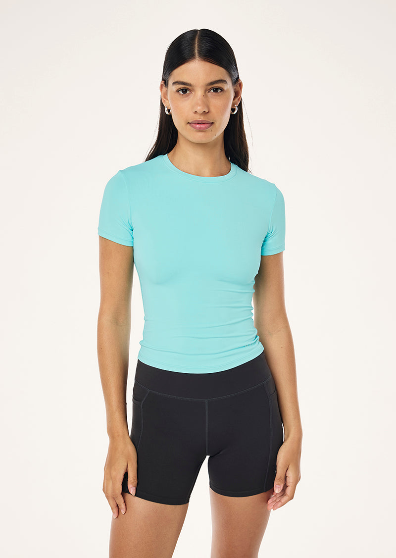 FOUNDATION SHORT SLEEVE TEE IN AQUA BY P.E NATION