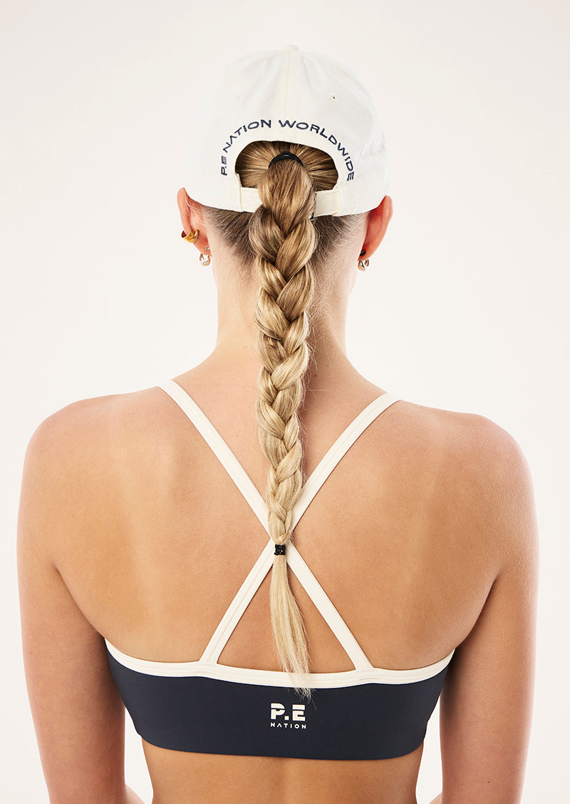 PHANTOM CAP IN WHISPER WHITE IN P.E NATION, WOMEN'S ATHLEISURE CAPS