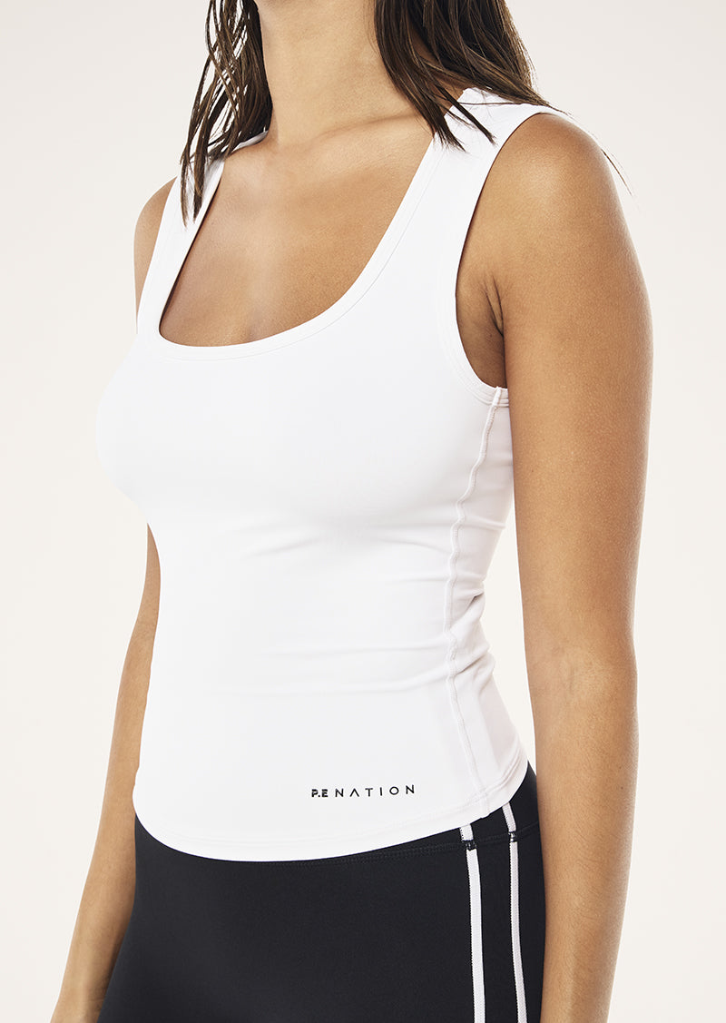 REFINE SCOOP TANK IN OPTIC WHITE BY P.E NATION WOMENS ATHLEISURE TANK TOP