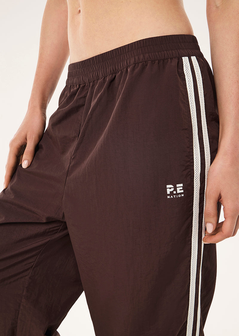 RELAY SPRAY TRACK PANT IN MAHOGANY