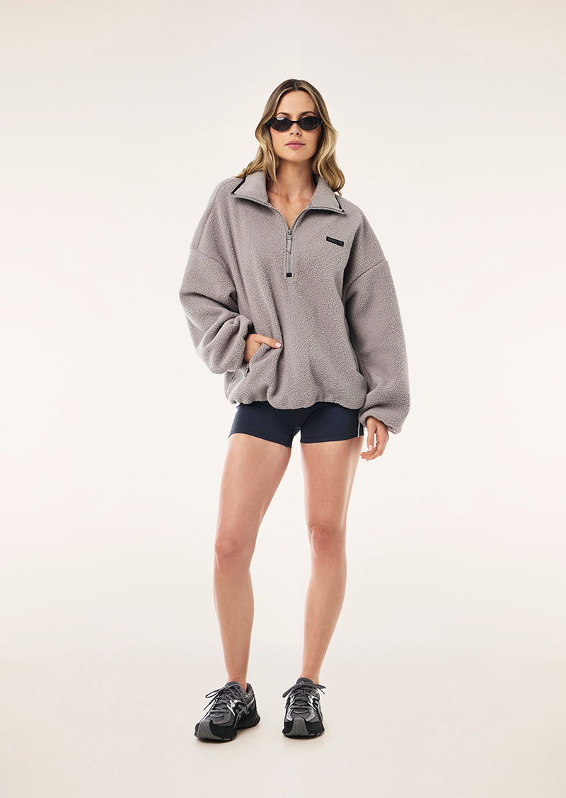 ROTATE QUARTER ZIP IN GREY