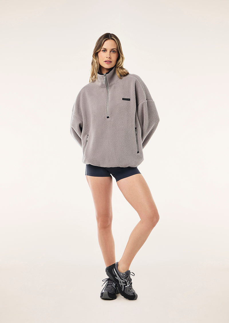 ROTATE QUARTER ZIP IN GREY