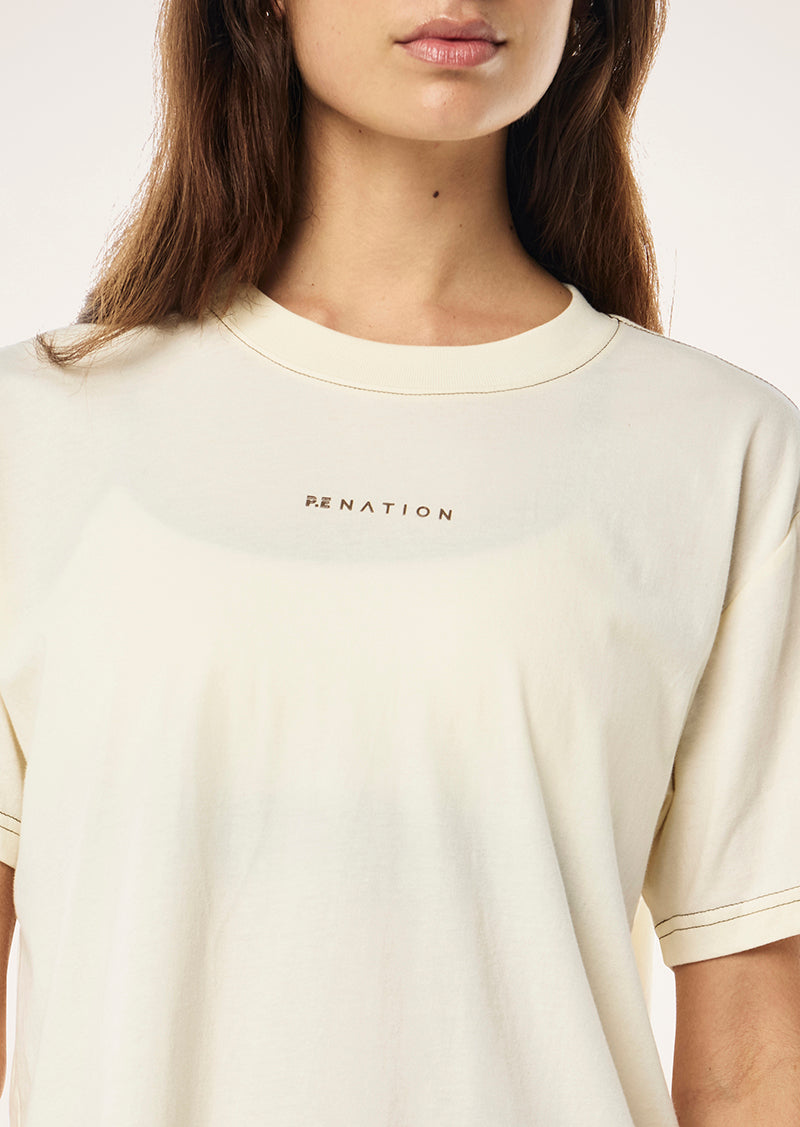 SHIFT TEE IN WHISPER WHITE BY P.E NATION, WOMENS ATHLEISURE GRAPHIC TEE CREAM