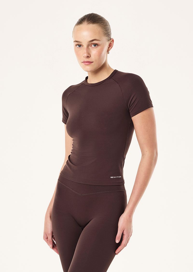 SIGNATURE SHORT SLEEVE TEE  IN DARK PLUM BY P.E NATION, WOMEN'S PILATES SHORT SLEEVE TEES