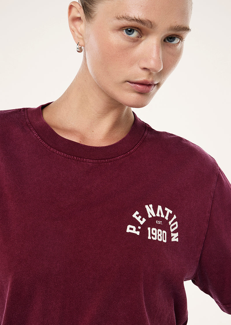 SWERVE TEE IN WASHED CABERNET BY P.E NATION, WOMEN'S ATHLEISURE TEES