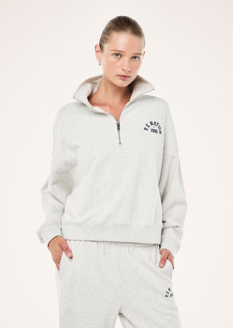 SWERVE ZIP NECK IN GREY MARLE BY P.E NATION