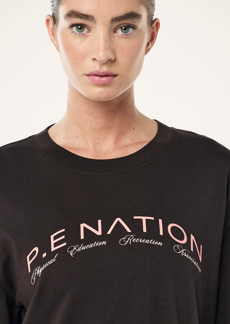 VOLUME LONG SLEEVE TEE IN LICORICE BY P.E NATION WOMENS ACTIVE TEE
