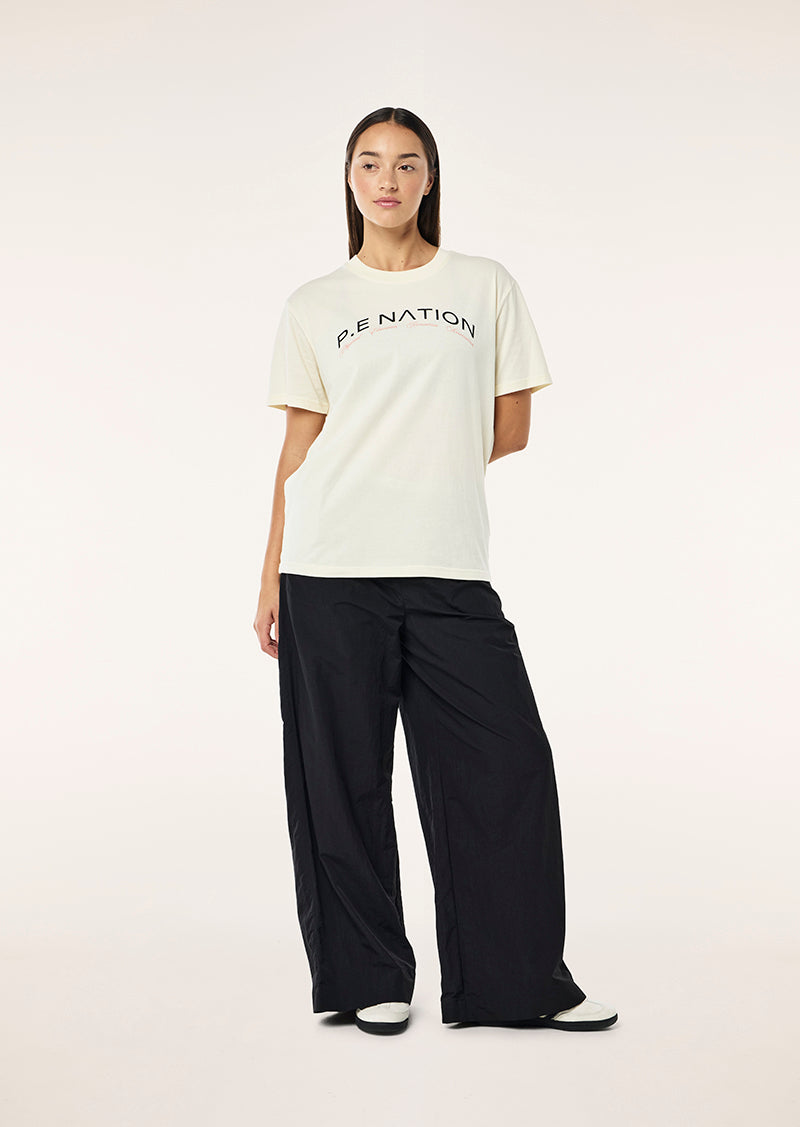 VOLUME TEE IN WHISPER WHITE BY P.E NATION WOMENS ACTIVE TEE TOP