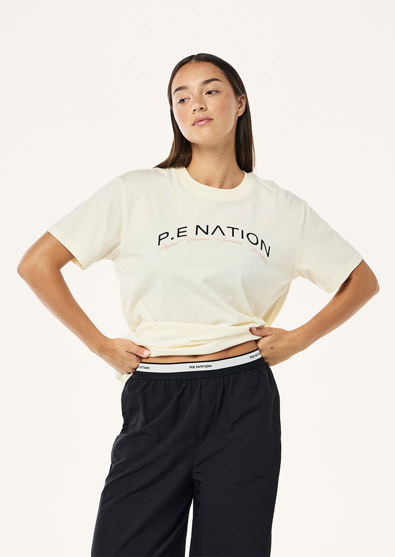 VOLUME TEE IN WHISPER WHITE BY P.E NATION WOMENS ACTIVE TEE TOP