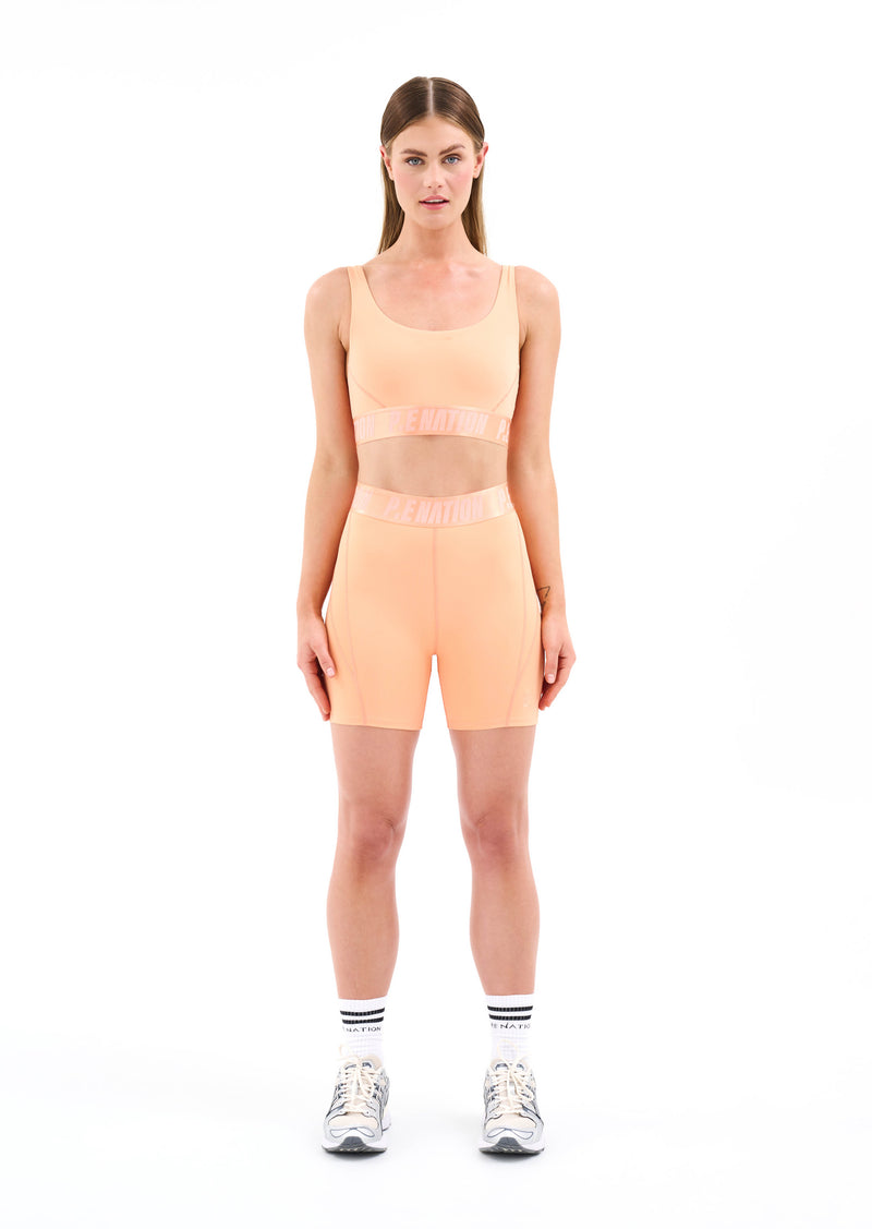 BACKCHECK SPORTS BRA IN CANTALOUPE