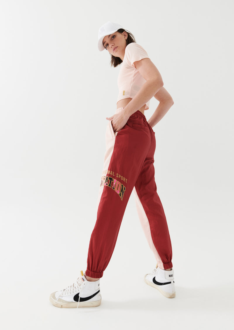 DOUBLE UNDER TRACKPANT IN CANDY