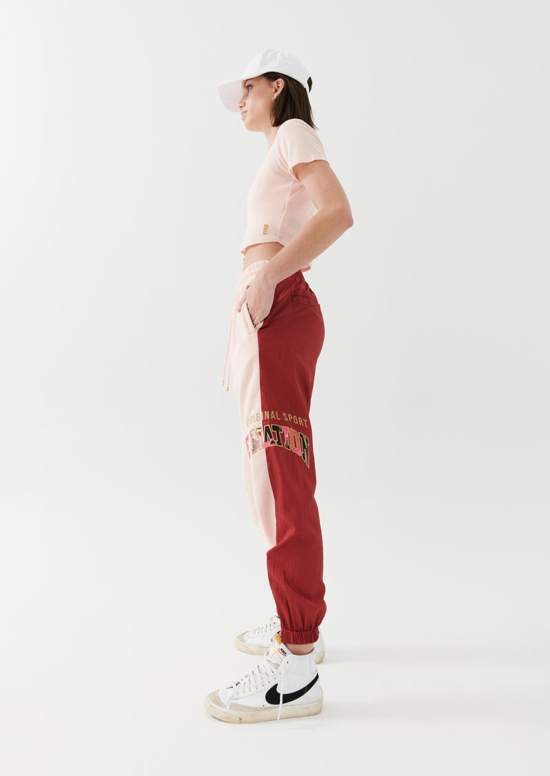 DOUBLE UNDER TRACKPANT IN CANDY