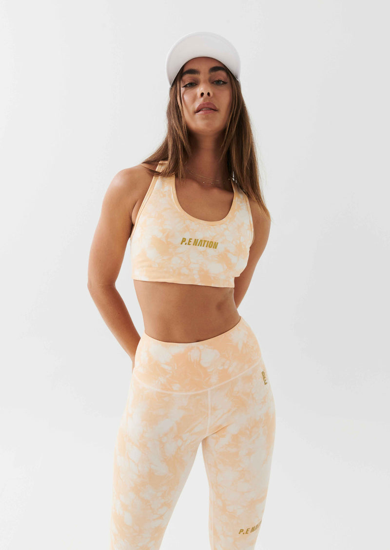 REACT SPORTS BRA IN GOLDEN SAND