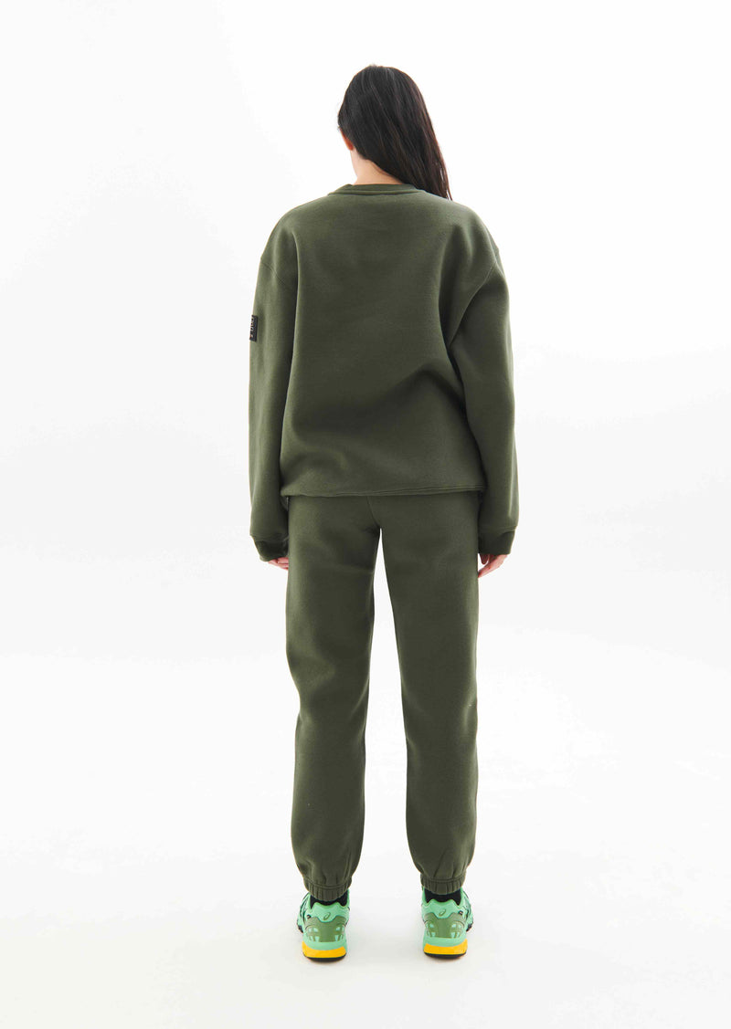 PRIMARY TRACKPANT IN RIFLE GREEN